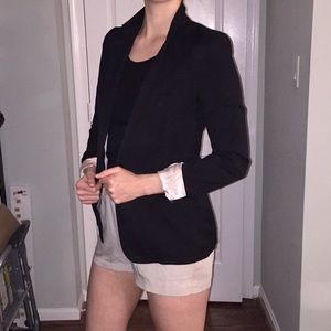 Black Blazer with pink lining.